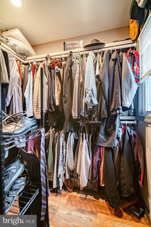 walk in closet featuring light hardwood / wood-style floors