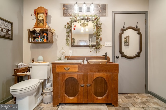 bathroom with toilet and vanity