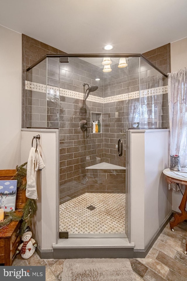 bathroom featuring an enclosed shower