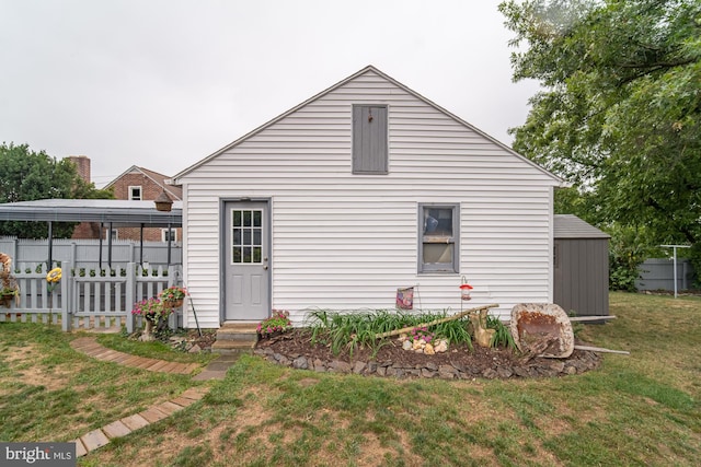 rear view of property with a yard