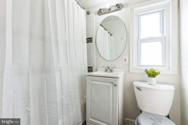 bathroom featuring vanity and toilet