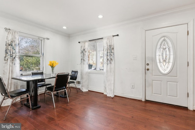 entryway with crown molding and dark hardwood / wood-style flooring