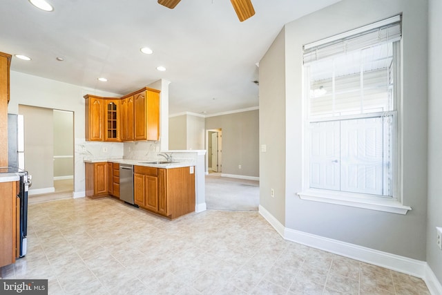 kitchen featuring sink, ceiling fan, range with electric stovetop, stainless steel dishwasher, and kitchen peninsula