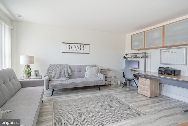 office space with light hardwood / wood-style floors