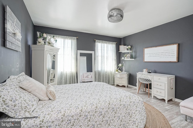 bedroom with hardwood / wood-style floors