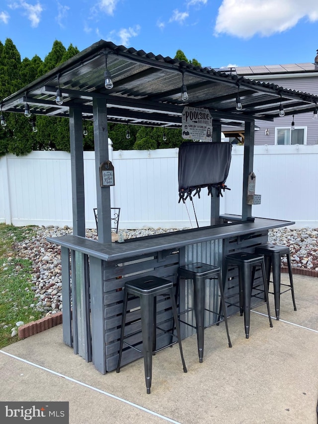 view of patio featuring an outdoor bar