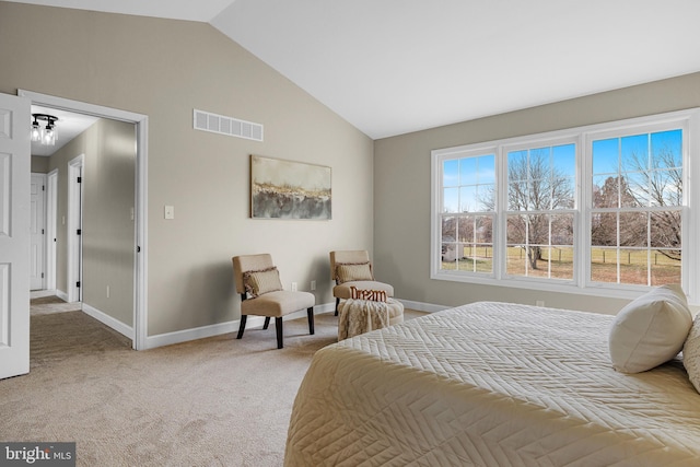 carpeted bedroom with vaulted ceiling