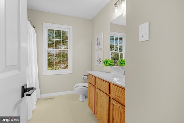 bathroom with vanity and toilet