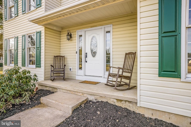 property entrance featuring covered porch