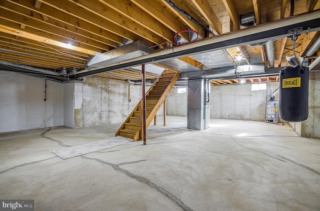 basement featuring gas water heater and heating unit