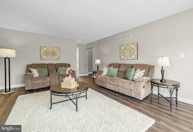 living room featuring dark hardwood / wood-style flooring