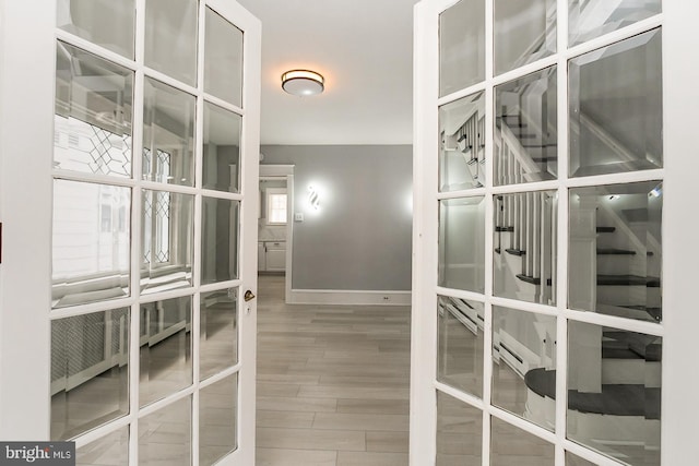 interior space featuring french doors and wood-type flooring