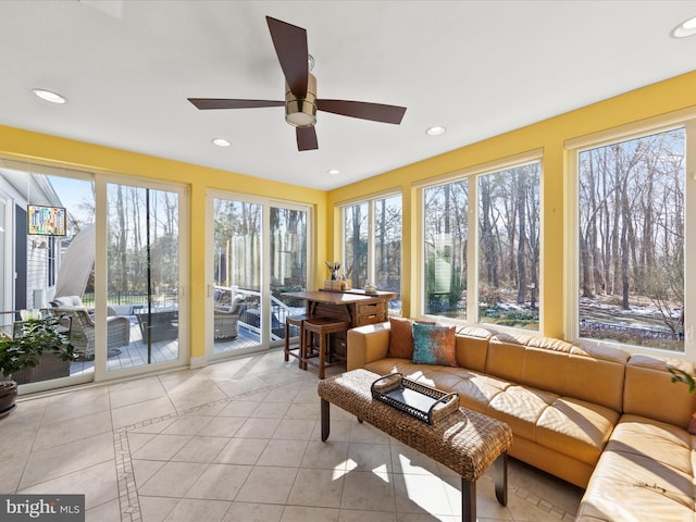 sunroom with ceiling fan and a wealth of natural light