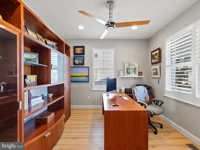 office space with ceiling fan and light hardwood / wood-style flooring