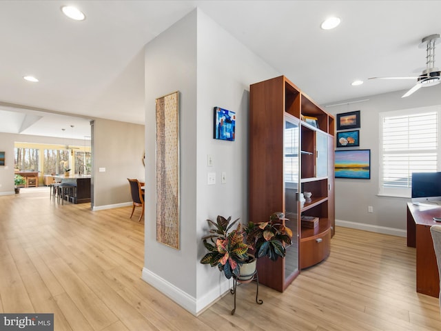 office space featuring ceiling fan and light hardwood / wood-style flooring