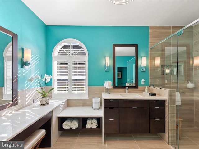 bathroom featuring vanity, an enclosed shower, and tile patterned flooring