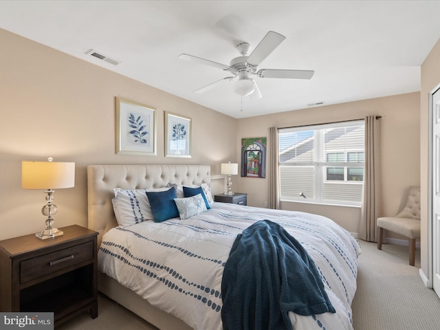 bedroom featuring ceiling fan and light carpet