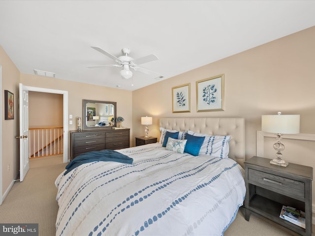 bedroom featuring light carpet and ceiling fan