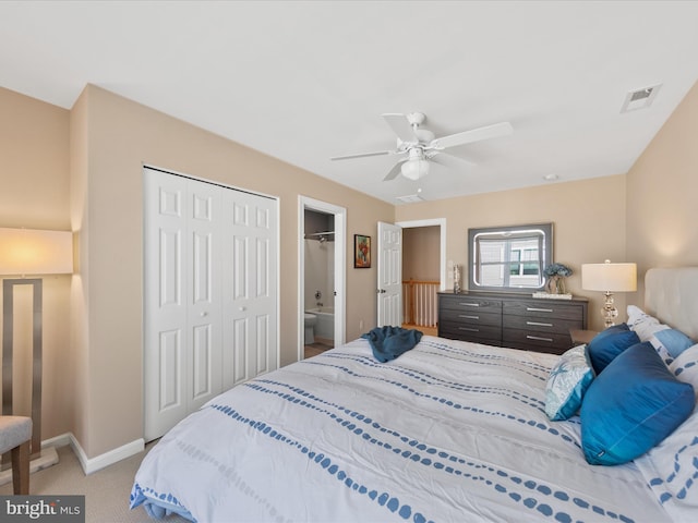 carpeted bedroom with ceiling fan and a closet