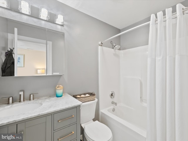 full bathroom featuring shower / bath combination with curtain, vanity, and toilet