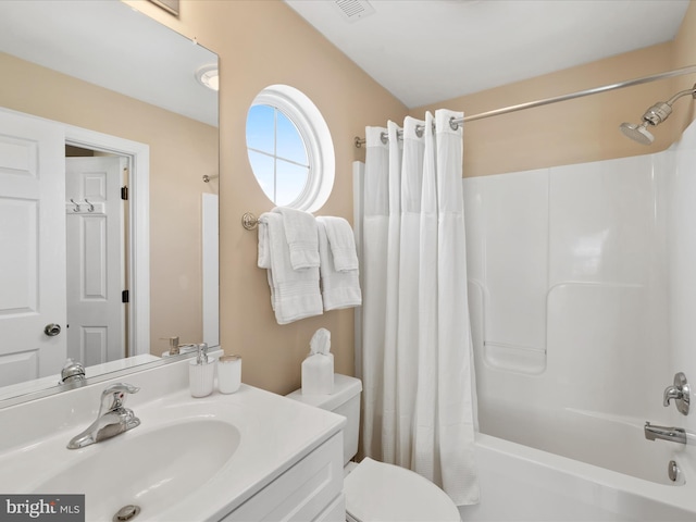 full bathroom with vanity, toilet, and shower / bath combo