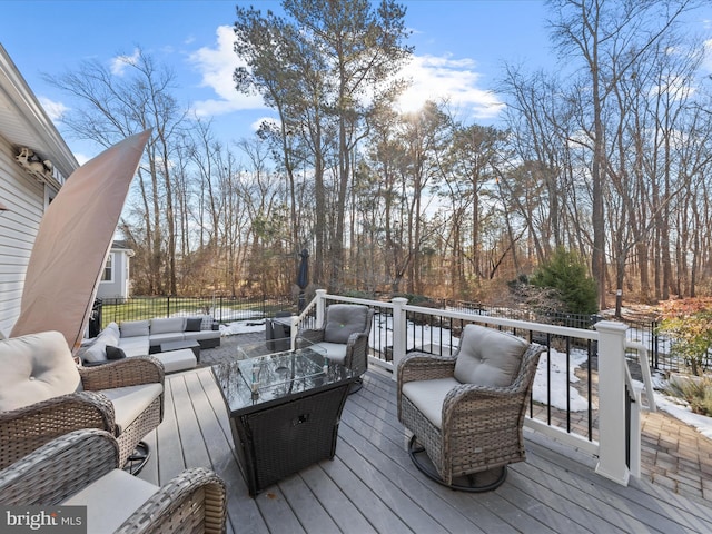 wooden deck featuring outdoor lounge area