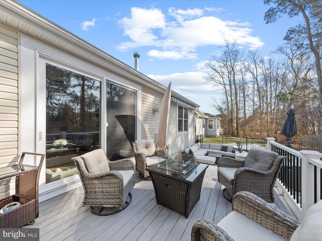 wooden terrace featuring an outdoor hangout area