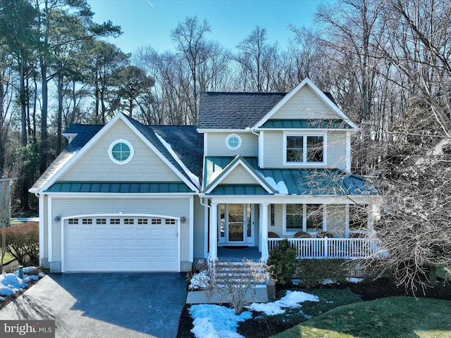 view of front of house with a porch and a garage