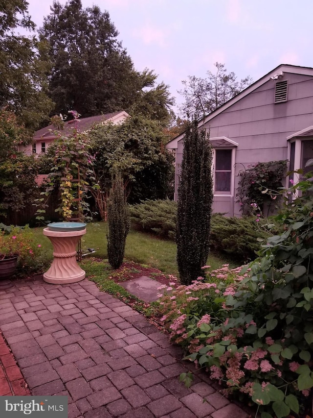 view of patio terrace at dusk