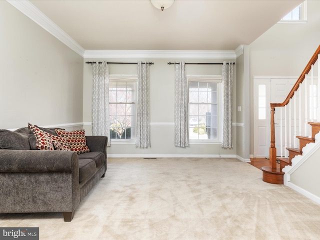 living area with stairway, carpet floors, baseboards, and ornamental molding