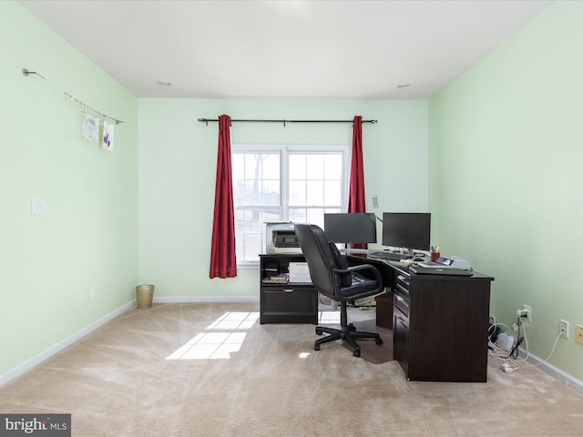 home office with baseboards and carpet