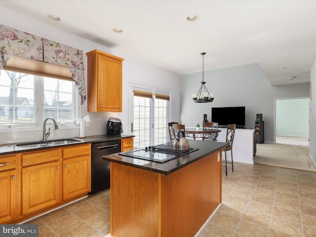 kitchen with a sink, black dishwasher, a healthy amount of sunlight, and stovetop with downdraft