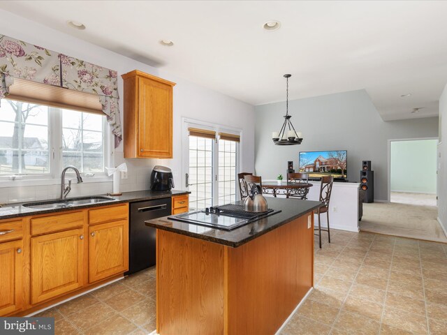 kitchen featuring a sink, dishwasher, a wealth of natural light, and stovetop with downdraft