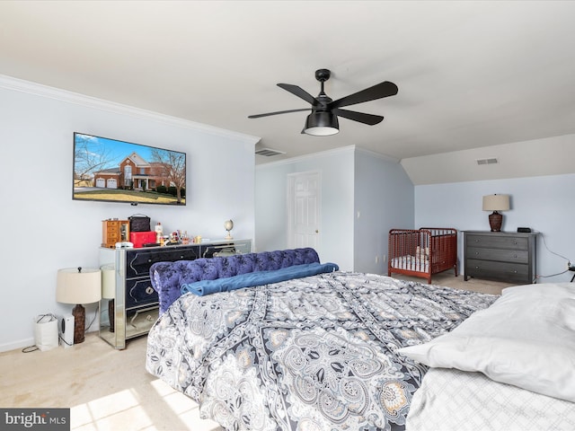 carpeted bedroom with visible vents, ceiling fan, crown molding, and baseboards