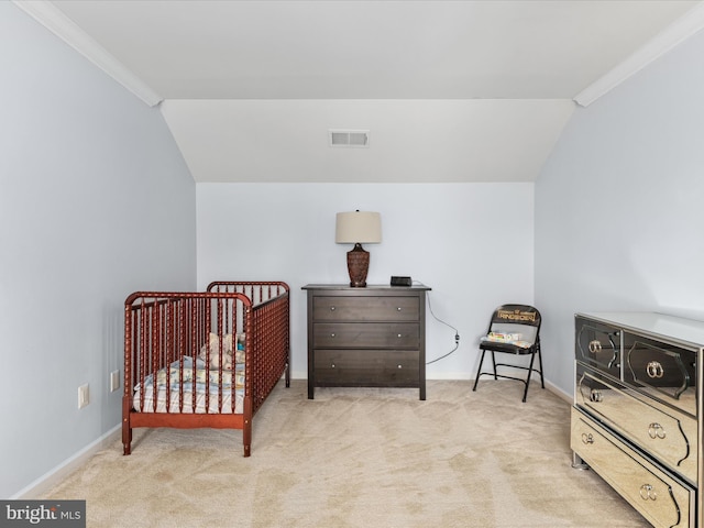 bedroom featuring vaulted ceiling, baseboards, visible vents, and carpet floors