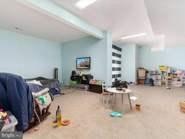 rec room featuring visible vents and carpet