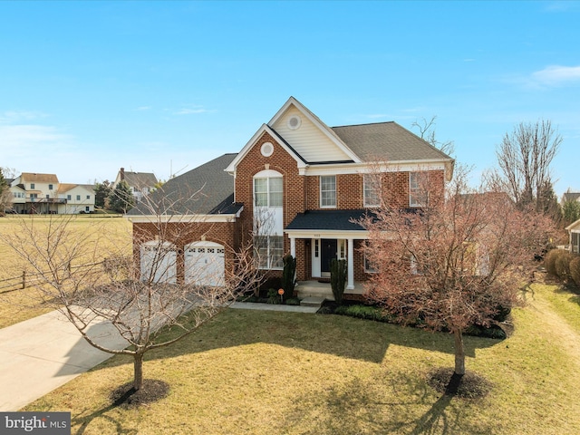 view of front of home with an attached garage, concrete driveway, a front yard, and a shingled roof