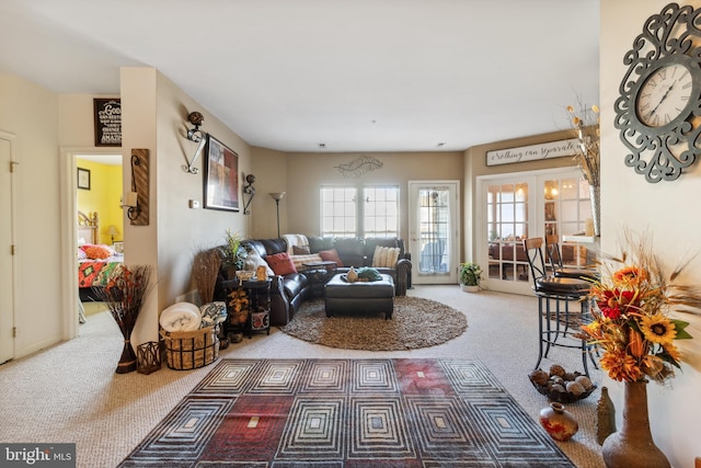 carpeted living room with french doors