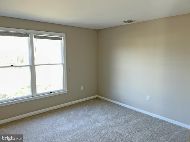 empty room featuring carpet floors