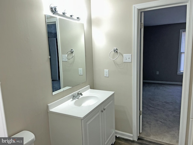 bathroom featuring vanity and toilet