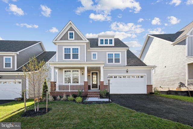 craftsman-style house with a porch and a front yard