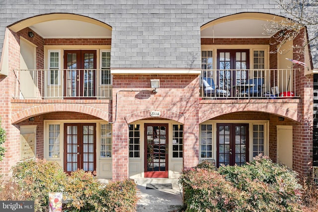 doorway to property with french doors and a balcony