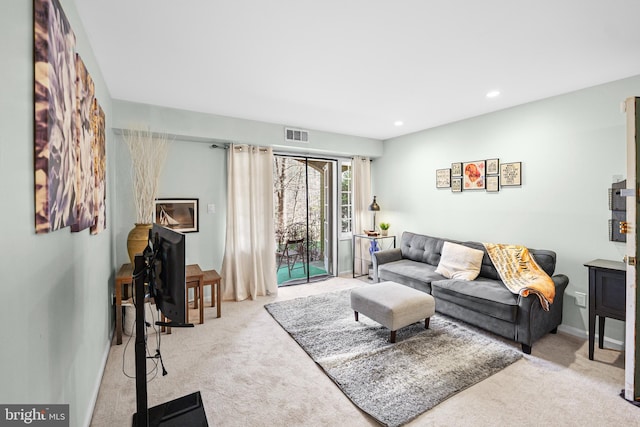 living room featuring light colored carpet