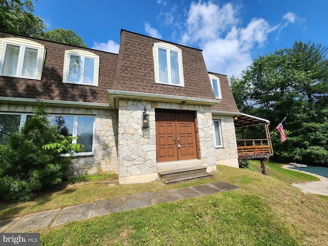 980 Creek Rd, Downingtown, PA 19335 - view of front of property with a shingled roof, stone siding, and a front lawn