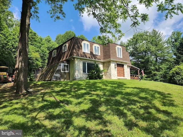 980 Creek Rd, Downingtown, PA 19335 - front facade featuring stone siding, a shingled roof, mansard roof, and a front lawn
