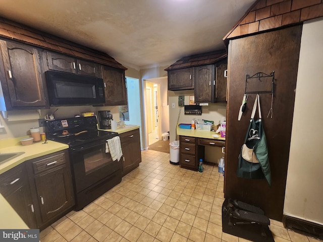 980 Creek Rd, Downingtown, PA 19335 - kitchen with black appliances, light countertops, dark brown cabinets, light tile patterned floors, and a sink