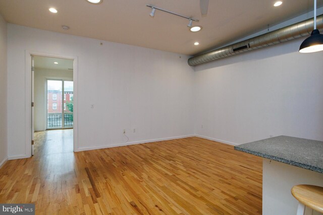 1215 N Hancock St, Philadelphia, PA 19122 - empty room with track lighting and hardwood / wood-style floors