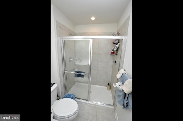 bathroom featuring toilet and walk in shower