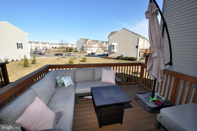 wooden deck featuring an outdoor hangout area