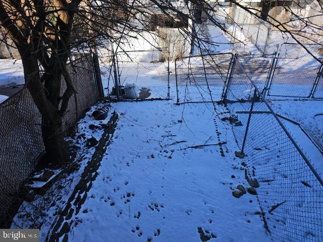 view of yard covered in snow